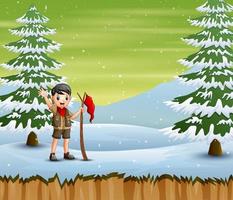 ragazzo esploratore con bandiera rossa in piedi nel paesaggio invernale vettore