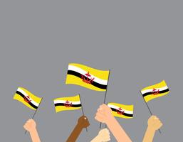 Illustrazione vettoriale mani tenendo le bandiere del Brunei isolato su sfondo