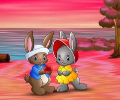 romantico di amare le coppie di conigli sulla spiaggia vettore