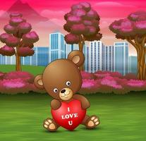 divertente baby orso seduto con cuore rosso vettore