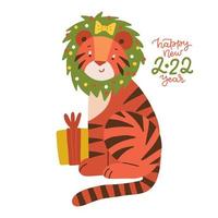 simpatico cartone animato tigre rossa a strisce con confezione regalo e ghirlanda di Natale in testa. divertente tigre - simbolo dell'anno 2022. biglietto di auguri di felice anno nuovo. illustrazione vettoriale piatta.