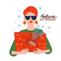 bella ragazza che indossa occhiali da sole e palline come orecchini con confezione regalo di Natale in mano. vacanza festiva. Merry Christmas greeting card illustrazione vettoriale piatta con scritte - credi nel tuo elfo.