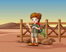 la ragazza esploratrice nel paesaggio desertico vettore