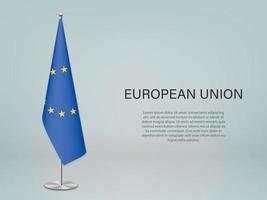 bandiera appesa dell'unione europea sul supporto. modello per divieto di conferenza vettore