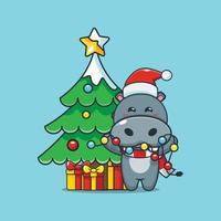simpatico personaggio dei cartoni animati di ippopotamo con lampada natalizia vettore