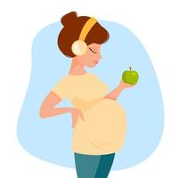 la donna incinta del fumetto sveglio in pantaloni e maglietta ascolta la musica con le cuffie tiene in mano la mela verde. illustrazione vettoriale in stile piatto.
