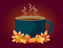 tazza blu di tè o caffè caldo con foglie autunnali.