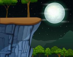 paesaggio della scogliera sulla montagna nella notte di luna piena vettore