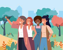 Gruppo di diverse donne che prendono selfie nel parco vettore