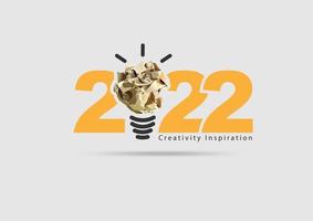 logo 2022 ispirazione alla creatività del nuovo anno, con design concettuale delle idee della lampadina della palla di carta stropicciata, illustrazione vettoriale