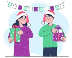 donna e un uomo con un cappello da Babbo Natale rosso tengono in mano i regali di Natale