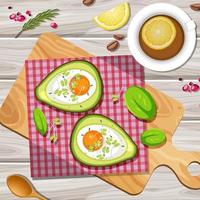vista dall'alto cibo cremoso uovo di avocado cuocere con tovaglietta su piastra di legno su sfondo di legno
