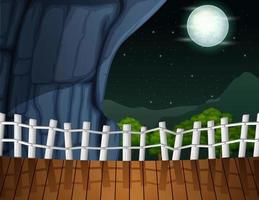 paesaggio notturno con una grotta e un'illustrazione di recinzione in legno