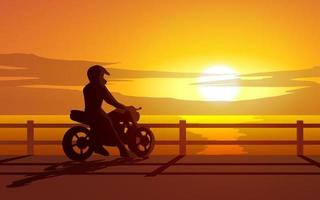 tramonto vista oceano con motociclista in silhouette