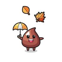 cartone animato del simpatico chip di cioccolato che tiene un ombrello in autunno vettore