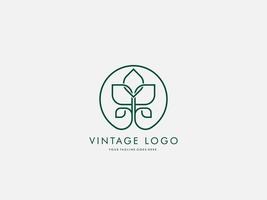 concetto di design del logo vettoriale foglia vintage