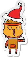 cartone animato adesivo felice di un robot che indossa il cappello di Babbo Natale vettore