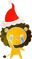 cartone animato retrò di un leone piangente che indossa il cappello di Babbo Natale vettore