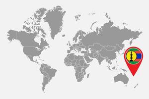 mappa pin con bandiera della nuova caledonia sulla mappa del mondo. illustrazione vettoriale. vettore
