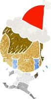 cartone animato retrò di una ragazza piangente che indossa abiti spaziali che indossano il cappello di Babbo Natale vettore