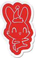 adesivo simpatico cartone animato di un coniglio che balla con il cappello di Babbo Natale vettore
