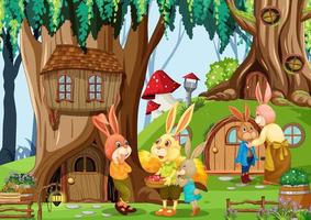famiglia di conigli nella foresta di fantasia vettore