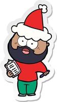 cartone animato adesivo di un uomo barbuto con appunti e penna che indossa un cappello da Babbo Natale vettore