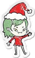 adesivo in difficoltà cartone animato di una ragazza vampira amichevole che indossa un cappello da Babbo Natale vettore