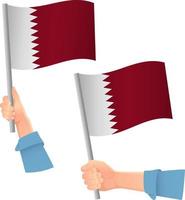 icona della bandiera del qatar in mano vettore