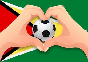 Guyana pallone da calcio e mano a forma di cuore vettore