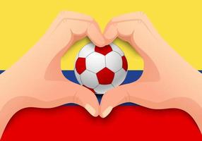 colombia pallone da calcio e mano a forma di cuore vettore