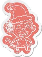 adesivo in difficoltà cartone animato urlante di una scimmia che indossa il cappello di Babbo Natale vettore