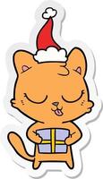 simpatico cartone animato adesivo di un gatto che indossa il cappello di Babbo Natale vettore
