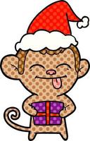 divertente illustrazione in stile fumetto di una scimmia con regalo di Natale che indossa il cappello di Babbo Natale vettore