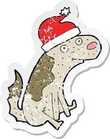 adesivo angosciato retrò di un cane cartone animato con cappello di Natale vettore