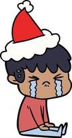 disegno a tratteggio di un ragazzo che piange con indosso il cappello di Babbo Natale vettore