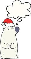 orso del fumetto che indossa il cappello di Natale e la bolla di pensiero vettore