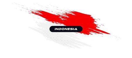 bandiera dell'indonesia con il concetto di pennello. felice festa dell'indipendenza indonesiana. bandiera dell'indonesia in stile grunge vettore