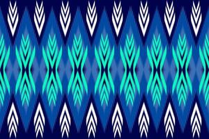 ikat blu art. modello etnico senza cuciture. stile tribale tradizionale. artigianato azteco. design per sfondo, illustrazione, trama, tessuto, batik, abbigliamento, confezionamento, carta da parati, moquette, ricamo vettore